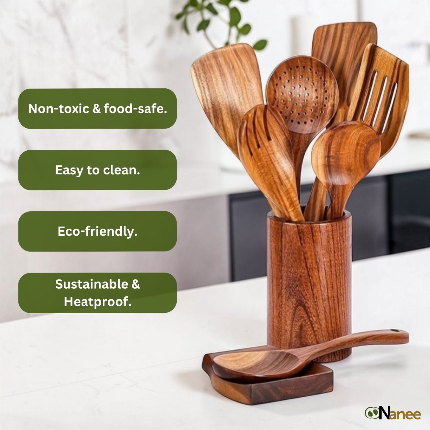 Wooden kitchen utensils set in a holder with green labels highlighting features on a white surface.