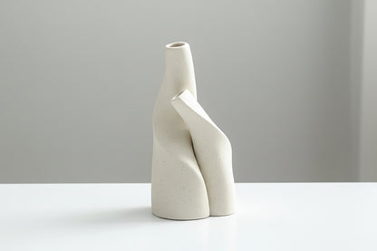 Two white ceramic vases on a table with product dimensions displayed.