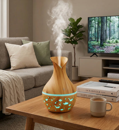 Wooden diffuser emitting steam in a living room with a TV and books in the background